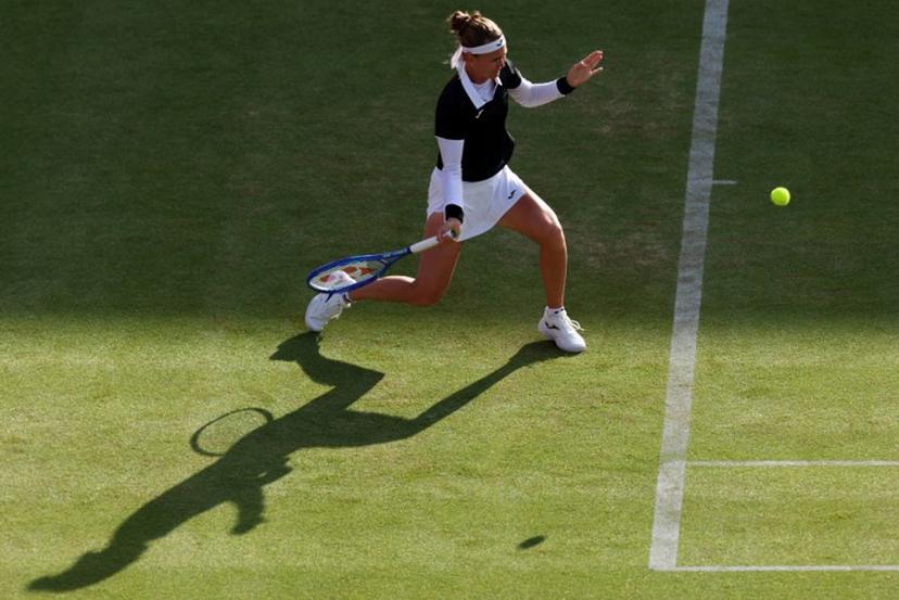 Czech Republic's Marie Bouzkova returns against Croatia's Donna Vekic during their round of 16 women's singles match at the HSBC WTA tennis Championships at Queen's Club in west London on June 10, 2026.  Adrian Dennis / AFP