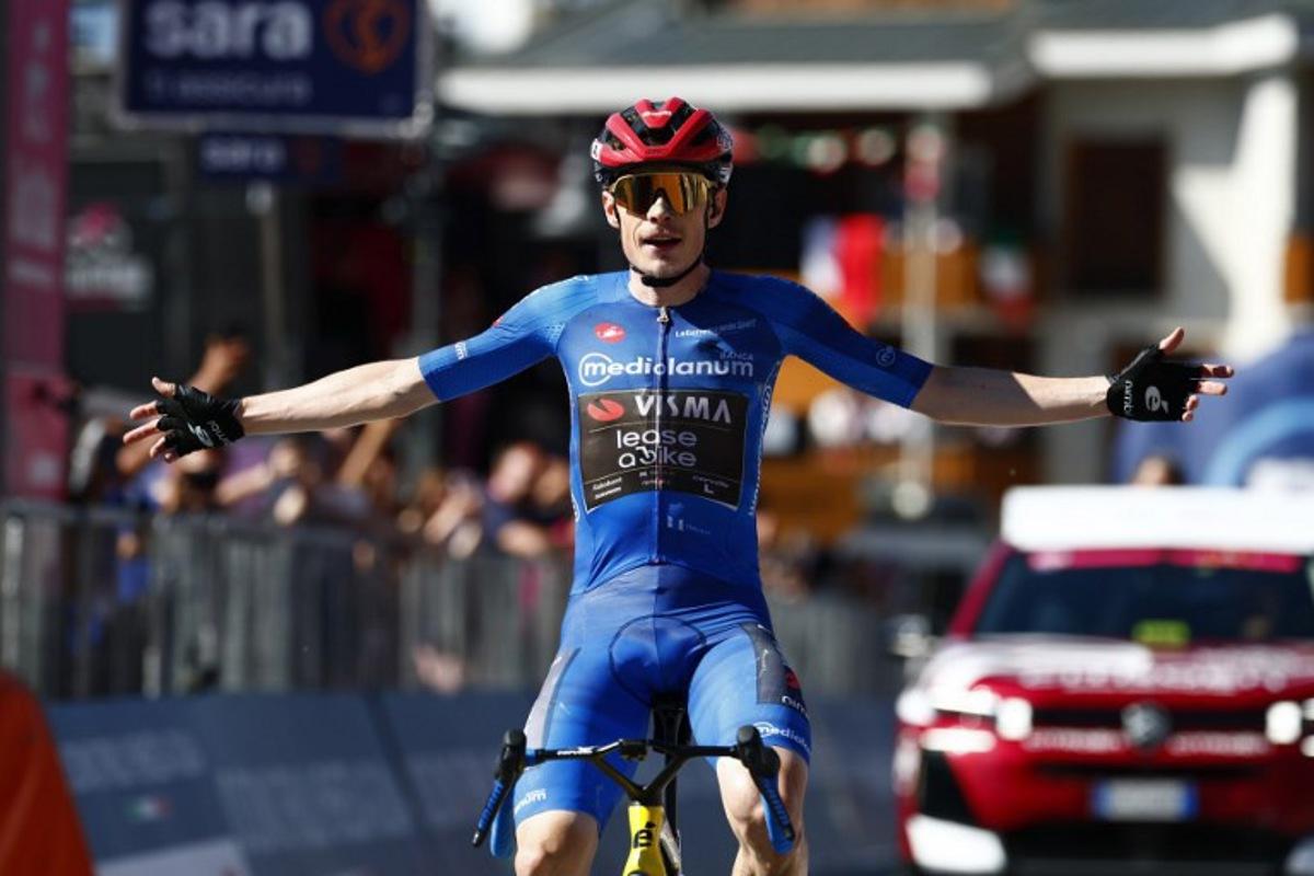 Team Visma Lease a Bike Danish rider Jonas Vingegaard crosses the finish line to win the 14th stage of the Giro d'Italia 2026 - Tour of Italy cycling race between Aosta and Pila (Gressan), Italy, on May 23, 2026.  Luca Bettini / AFP