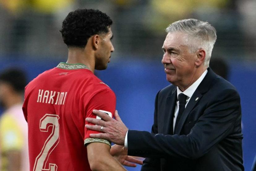 Brazil's Italian head coach Carlo Ancelotti greets Morocco's defender #02 Achraf Hakimi at the end of the 2026 World Cup Group C football match between Brazil and Morocco at the New York/New Jersey Stadium in East Rutherford on June 13, 2026.  Mauro PIMENTEL / AFP