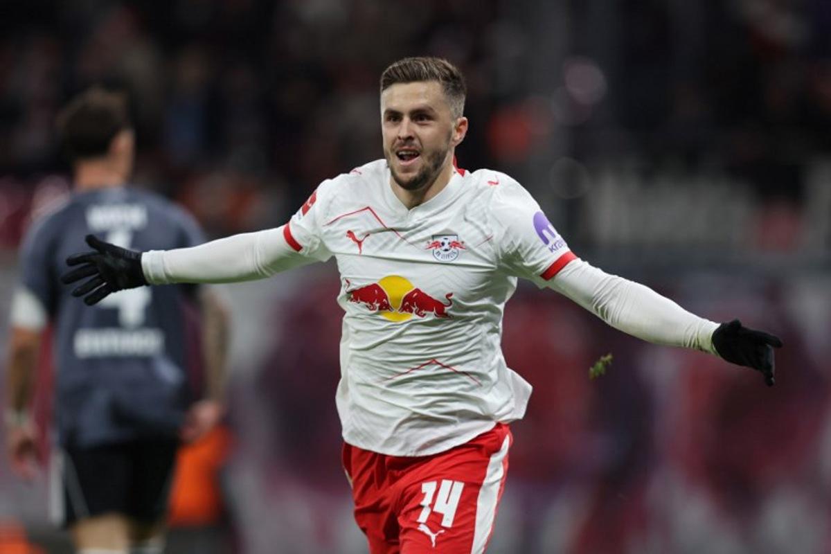 Leipzig's Austrian midfielder #14 Christoph Baumgartner celebrates scoring the 2-0 goal  during the German first division Bundesliga football match between RB Leipzig and Eintracht Frankfurt in Leipzig, eastern Germany, on December 6, 2025.  Ronny HARTMANN / AFP