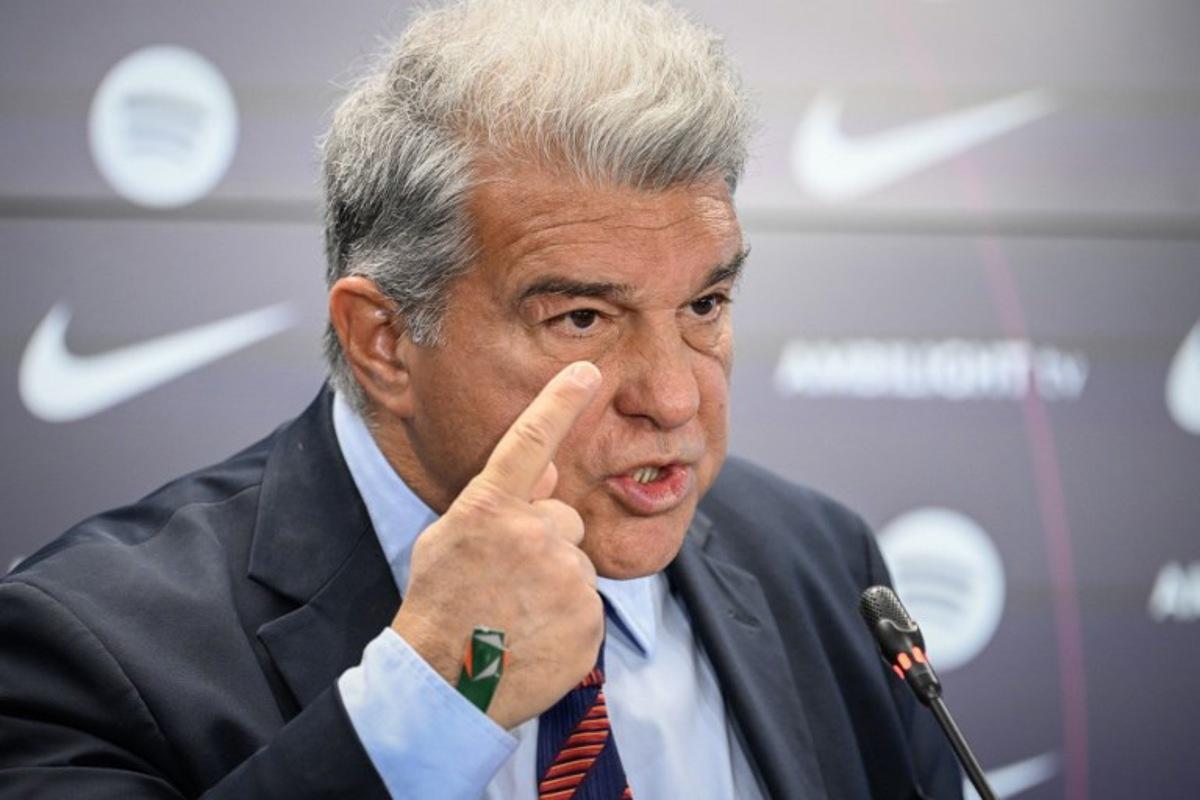 FC Barcelona's President Joan Laporta gestures during a press conference at the Ciudad Deportiva Joan Gamper in Sant Joan Despi, near Barcelona, on January 14, 2025. Dani Olmo's future at Barcelona remains in the balance as the Catalan club pursue their legal battle to get the midfielder registered to play once more. FC Barcelona's failure to meet La Liga's budgetary rules to license both Olmo and forward Pau Victor before the end of last year currently leaves them ineligible to play for the rest of the season.  Josep LAGO / AFP