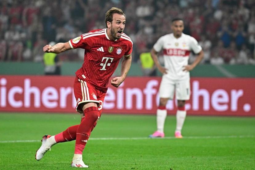 Bayern Munich's English forward #09 Harry Kane celebrates scoring the 3-0 goal from the penalty spot during the German Cup (DFB Pokal) final football match FC Bayern Munich v VfB Stuttgart at the Olympic Stadium in Berlin, on May 23, 2026.  Tobias SCHWARZ / AFP