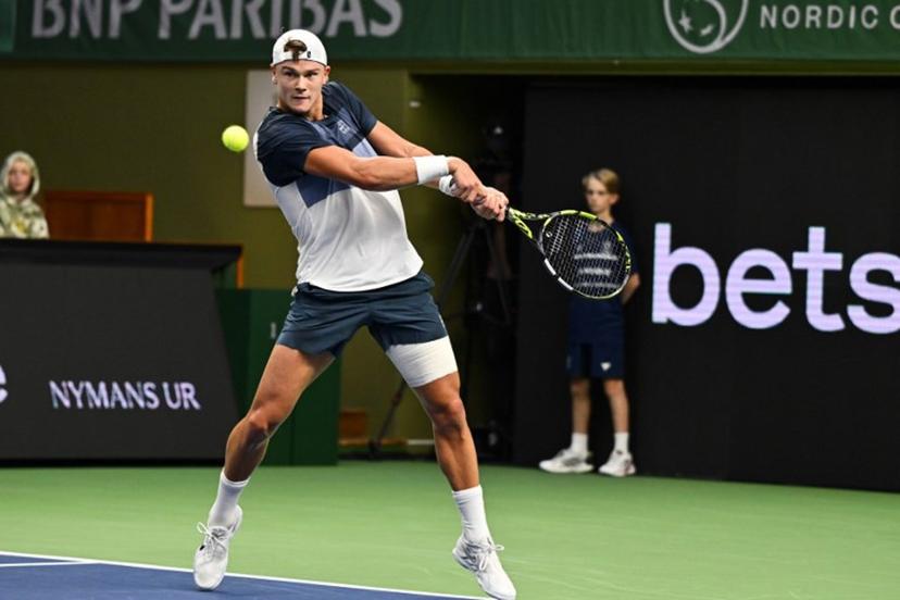 Denmark's Holger Rune returns the ball to  France's Ugo Humbert (not in Picture) during the semi-final of the BNP Paribas Nordic Open tennis tournament at the Royal Swedish Tennis Hall in Stockholm, Sweden, on October 18, 2025.   Anders WIKLUND / TT NEWS AGENCY / AFP