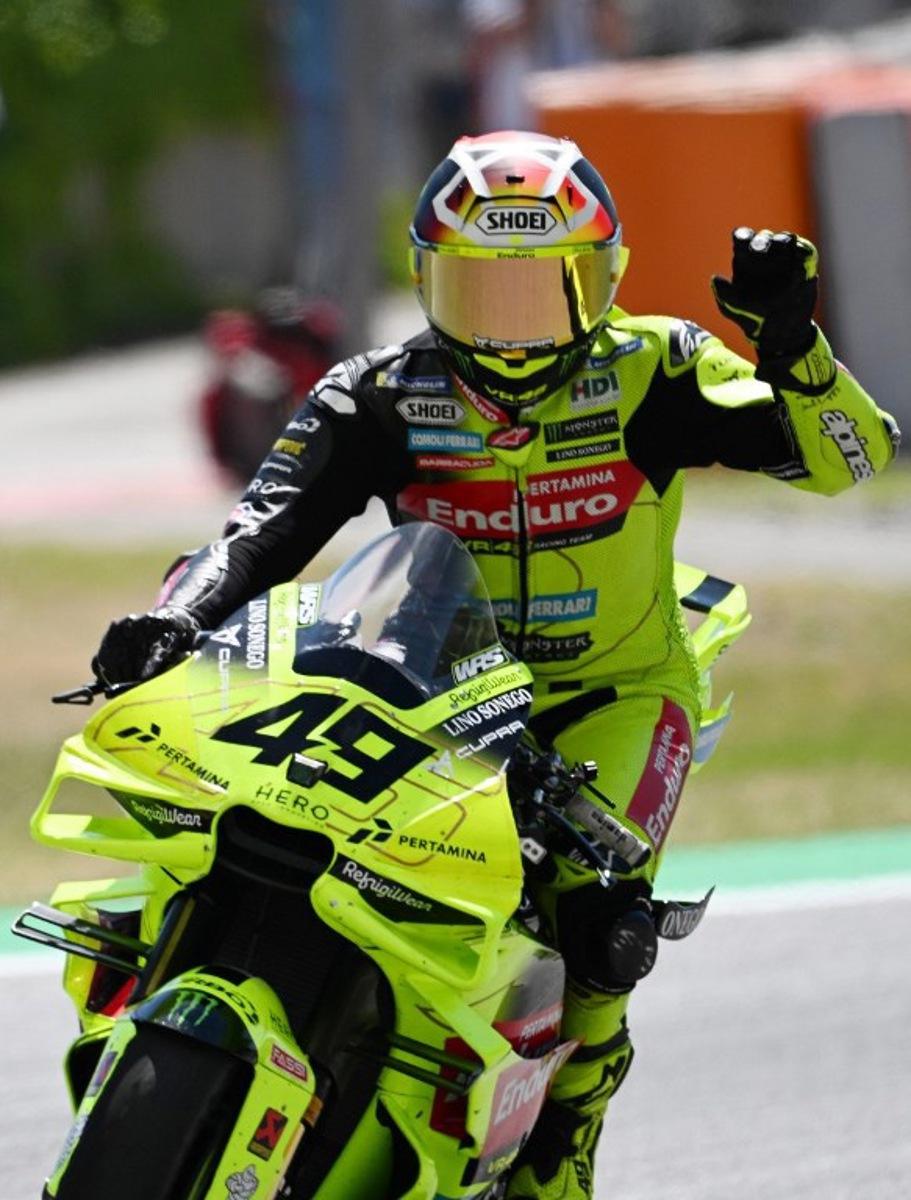 Team Pertamina Enduro VR46 Racing Team's Fabio Di Giannantonio celebrates his thirs place after the Sprint Race at the Catalunya Moto GP Grand Prix at the Catalunya racetrack in Montmelo, near Barcelona, on May 16, 2026.  Jose Jordan / AFP