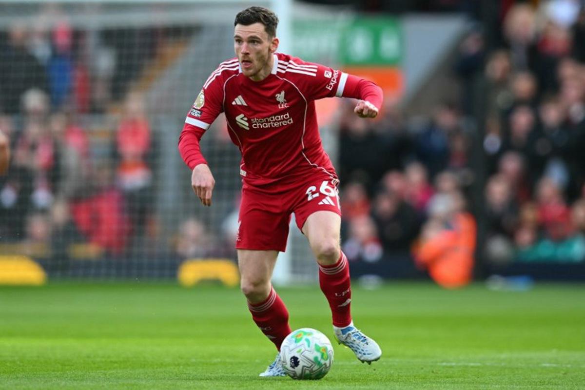 Liverpool's Scottish defender #26 Andrew Robertson looks to play a pass during the English Premier League football match between Liverpool and Fulham at Anfield in Liverpool, north west England on April 11, 2026. ANDY BUCHANAN / AFP