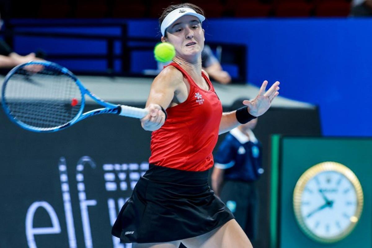 Belgium's Jana Otzipka hits a return to Ukraine's Anhelina Kalinina during their women's singles quarter-final match at the Billie Jean King Cup tennis tournament in Shenzhen, southern China's Guangdong province on September 24, 2026. CN-STR / AFP