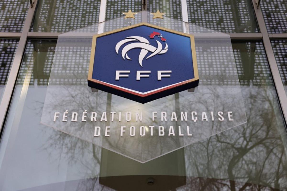 A picture taken on January 11, 2023 shows the logo of the French Football Federation (FFF) on the facade of its headquarters in Paris. Thomas SAMSON / AFP