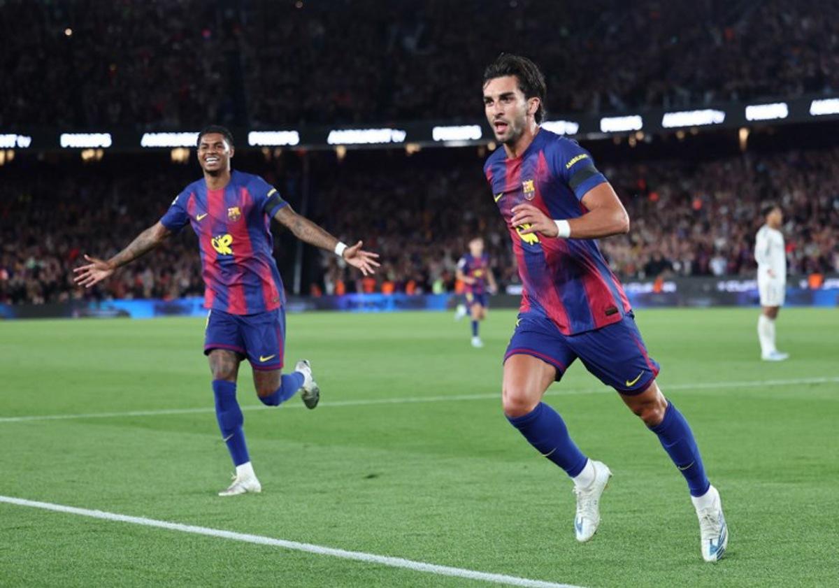 Barcelona's Spanish forward #07 Ferran Torres (R) celebrates scoring his team's second goal with Barcelona's English forward #14 Marcus Rashford during the Spanish league football match between FC Barcelona and Real Madrid CF at Camp Nou Stadium in Barcelona on May 10, 2026. Josep LAGO / AFP