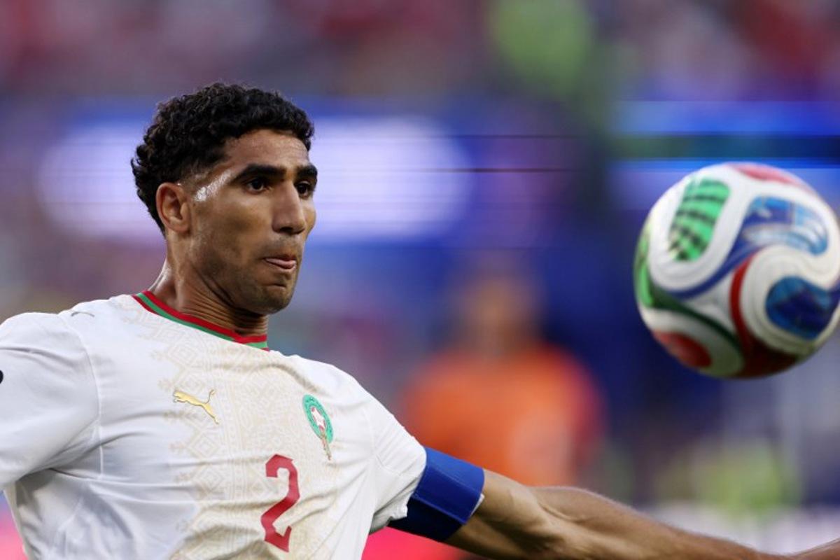Morocco's defender #02 Achraf Hakimi eyes the ball during the 2026 World Cup Group C football match between Scotland and Morocco at the Boston Stadium in Foxborough on June 19, 2026. FRANCK FIFE / AFP