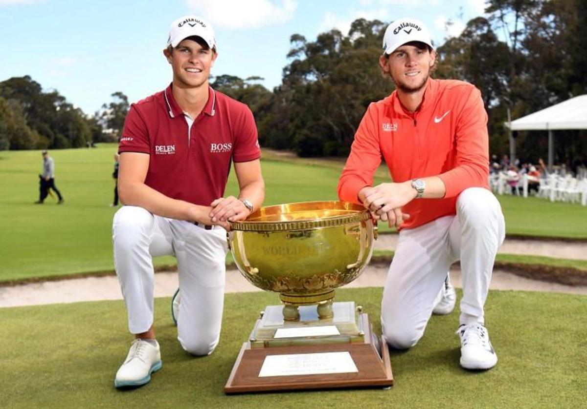 Thomas Detry (L) and Thomas Pieters of Belgium celebrate with the trophy after winning the World Cup of Golf at the Metropolitan Golf Club in Melbourne on November 25, 2018. William WEST / AFP -- IMAGE RESTRICTED TO EDITORIAL USE - STRICTLY NO COMMERCIAL USE --
