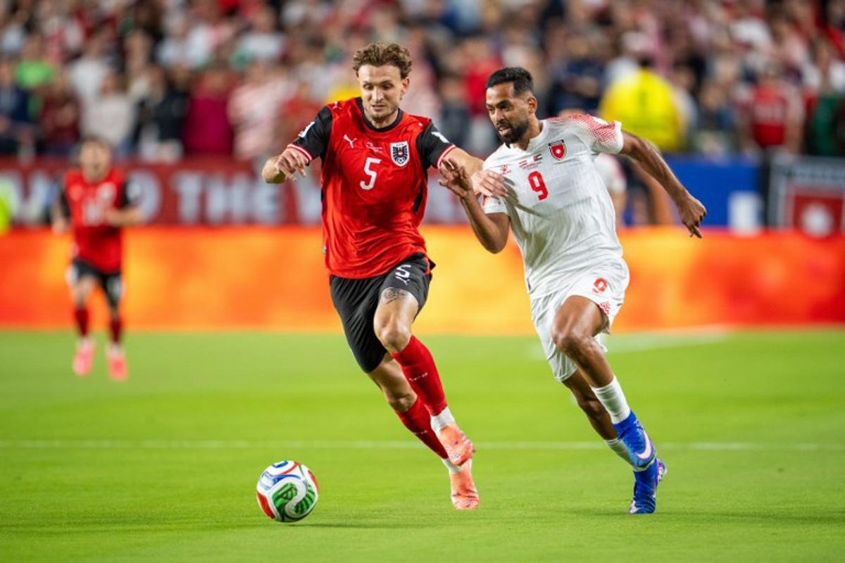 Austria's defender #05 Stefan Posch and Jordan's forward #09 Ali Olwan fight for the ball during the 2026 World Cup Group J football match between Austria and Jordan at the San Francisco Bay Area Stadium in Santa Clara, on June 16, 2026. GEORG HOCHMUTH / APA / AFP