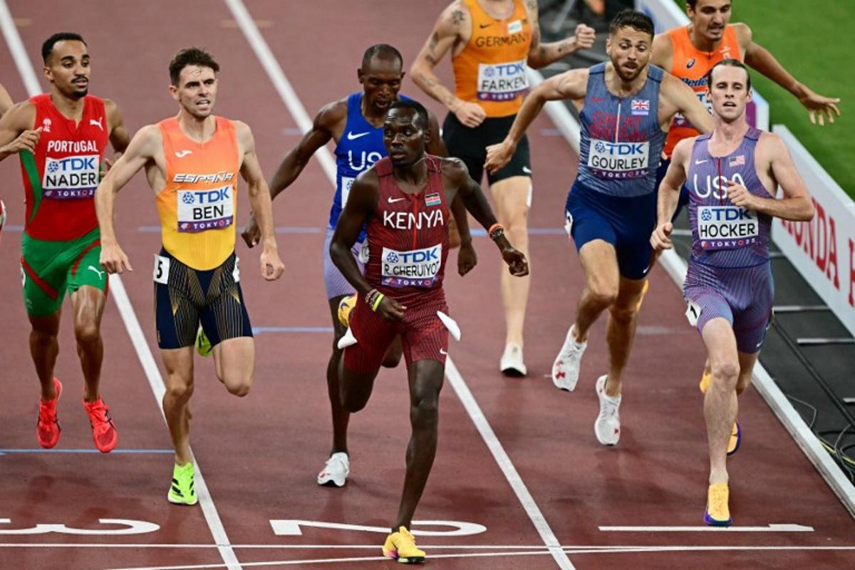 (L-R) Portugal's athlete Isaac Nader, Spain's athlete Adrian Ben, US' athlete Jonah Koech, Kenya's Reynold Cheruiyot, Germany's athlete Robert Farken, Britain's athlete Neil Gourley, Netherlands' athlete Stefan Nillessen and US' athlete Cole Hocker cross the finish line as they compete in the men's 1500m semi-final during the World Athletics Championships in Tokyo on September 15, 2025. Yuichi YAMAZAKI / AFP