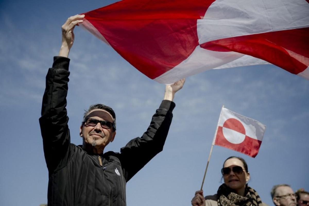 Protestors hold the Greenlandic flag as the demonstrate against the new American consulate in Nuuk, Greenland, on May 21, 2026. Oscar Scott Carl / Ritzau Scanpix / AFP
