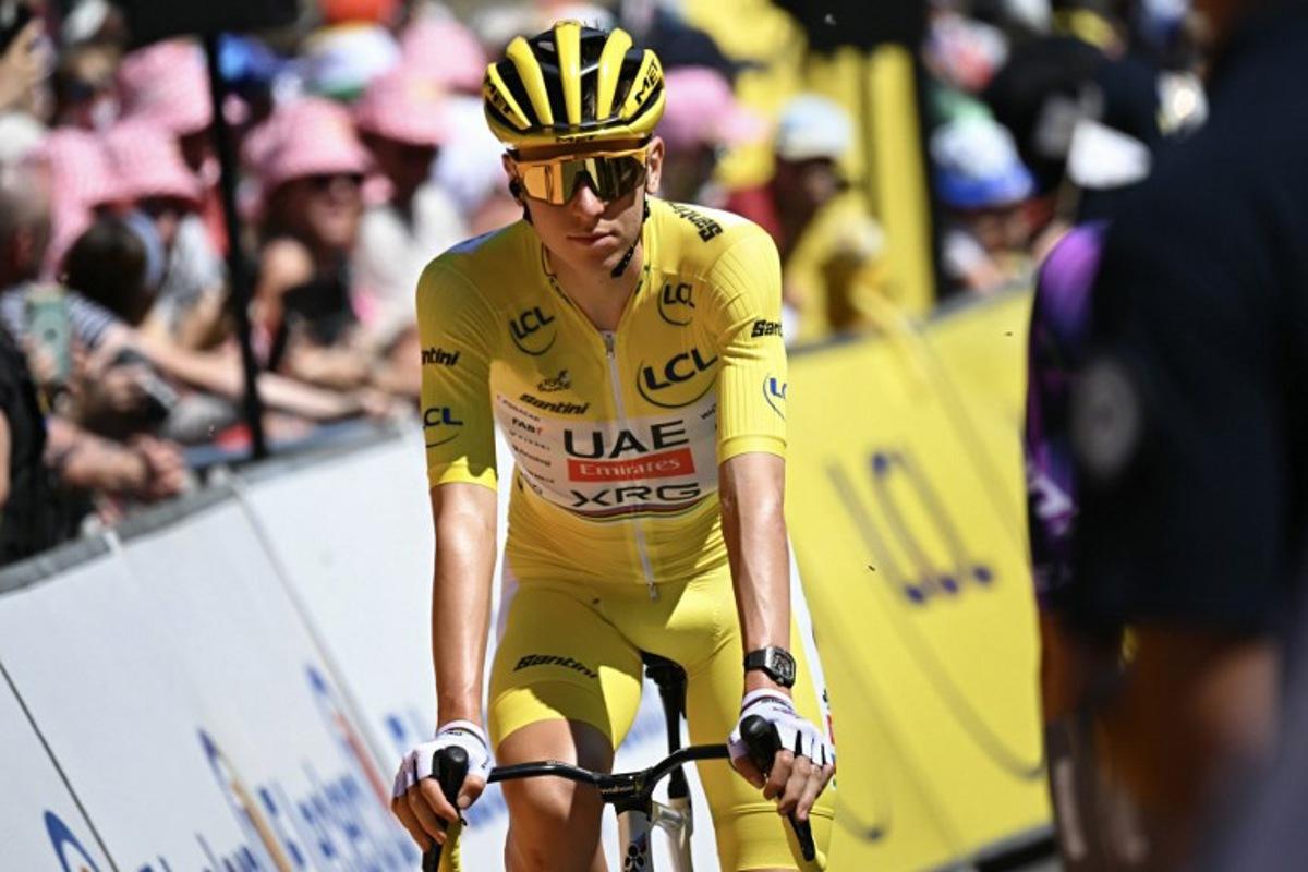 UAE Team Emirates - XRG team's Slovenian rider Tadej Pogacar wearing the overall leader's yellow jersey looks on at the start of the 6th stage of the 112th edition of the Tour de France cycling race, 201.5 km between Bayeux and Vire Normandie, Northwestern France on July 10, 2025. Loic VENANCE / AFP