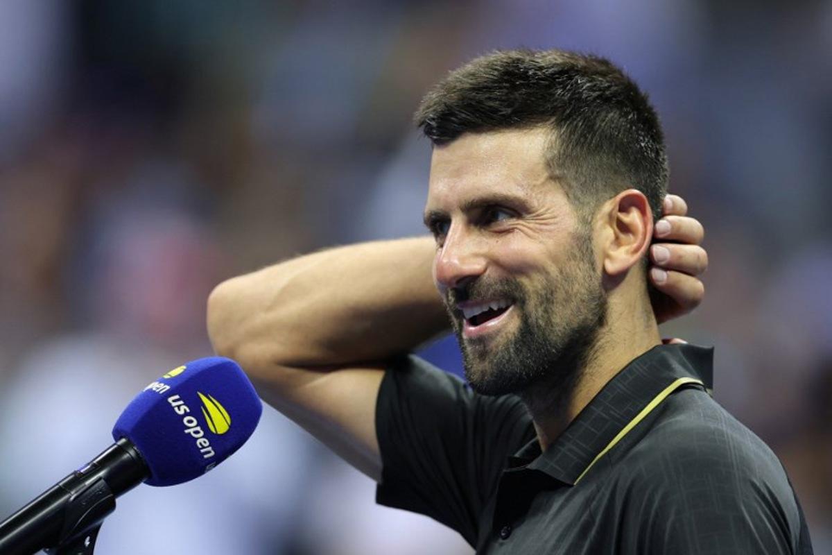 Serbia's Novak Djokovic speaks during a post-match interview after winning his men's singles first round tennis match against USA's Learner Tien on day one of the US Open tennis tournament at the USTA Billie Jean King National Tennis Center in New York City, on August 24, 2025. CHARLY TRIBALLEAU / AFP