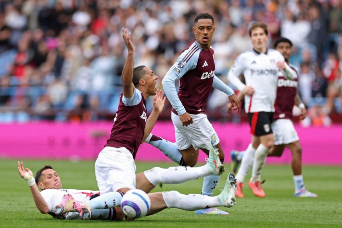 Fulham's Serbian midfielder #20 Sasa Lukic (L) vies with Aston Villa's Belgian midfielder #08 Youri Tielemans (2L) during the English Premier League football match between Aston Villa and Fulham at Villa Park in Birmingham, central England on May 3, 2025. Adrian Dennis / AFP