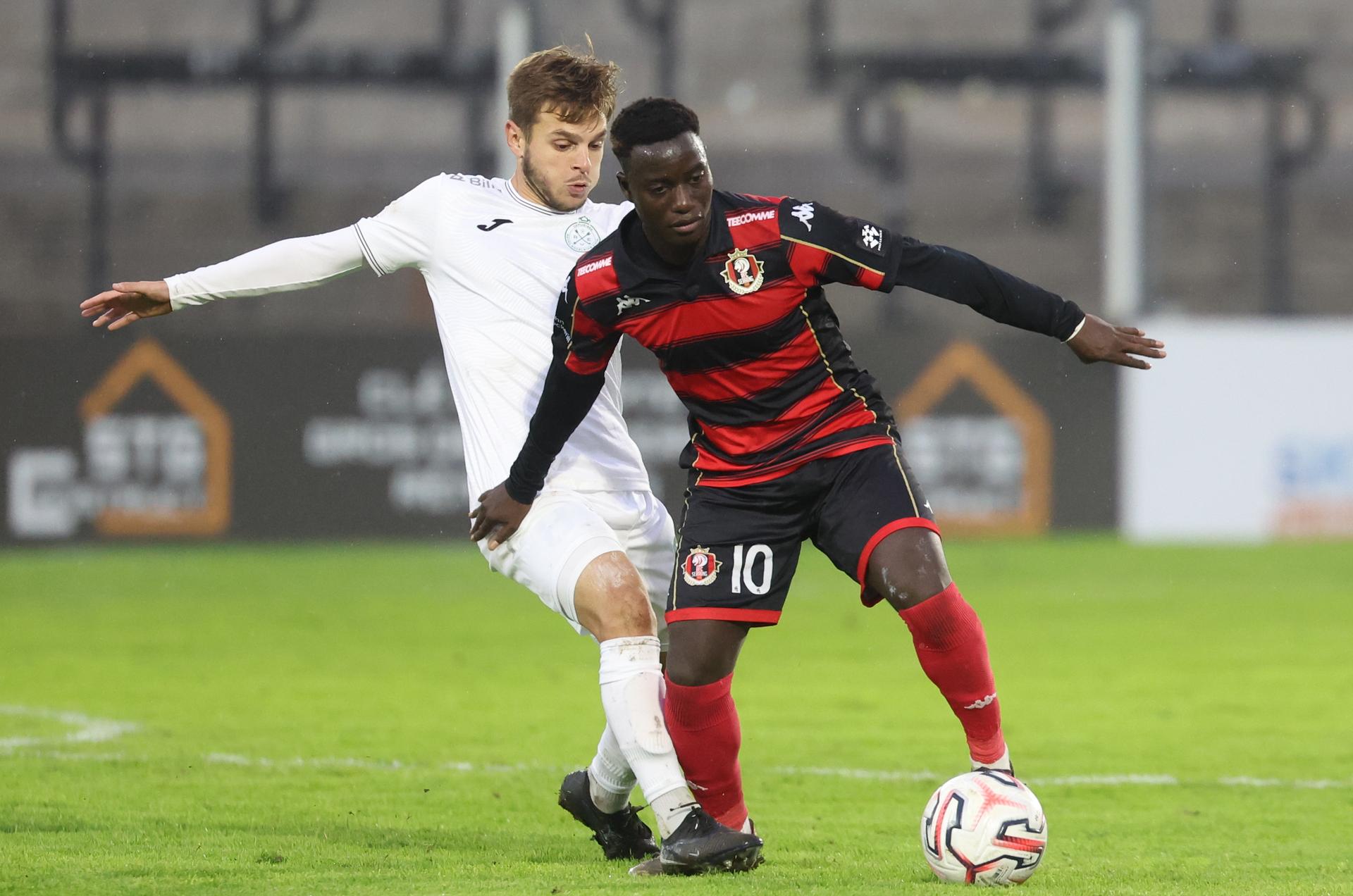 Virton's Gaetan Arib and Seraing's Saliou Faye fight for the ball during a soccer match between RFC Seraing and Excelsior Virton, Saturday 24 October 2026 in Seraing, on day 8 of the 2026-2027 'Challenger Pro League' second highest division of the Belgian championship. BELGA PHOTO VIRGINIE LEFOUR