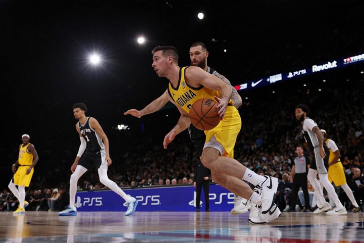 Indiana Pacers' US guard #09 TJ McConnell dribbles the ball during the NBA basketball game between the San Antonio Spurs and the Indiana Pacers at the Accor Arena - Palais Omnisports de Paris-Bercy - in Paris on January 25, 2025. FRANCK FIFE / AFP