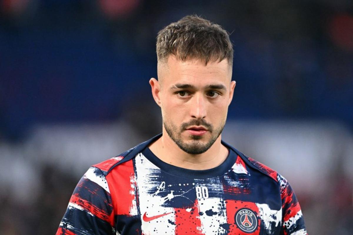 Paris Saint-Germain's Spanish goalkeeper #80 Arnau Tenas looks on during the warm up ahead of the UEFA Champions League Quarter final first leg football match between Paris Saint-Germain (FRA) and Aston Villa (ENG) at the Parc des Princes stadium in Paris on April 9, 2025. Bertrand GUAY / AFP