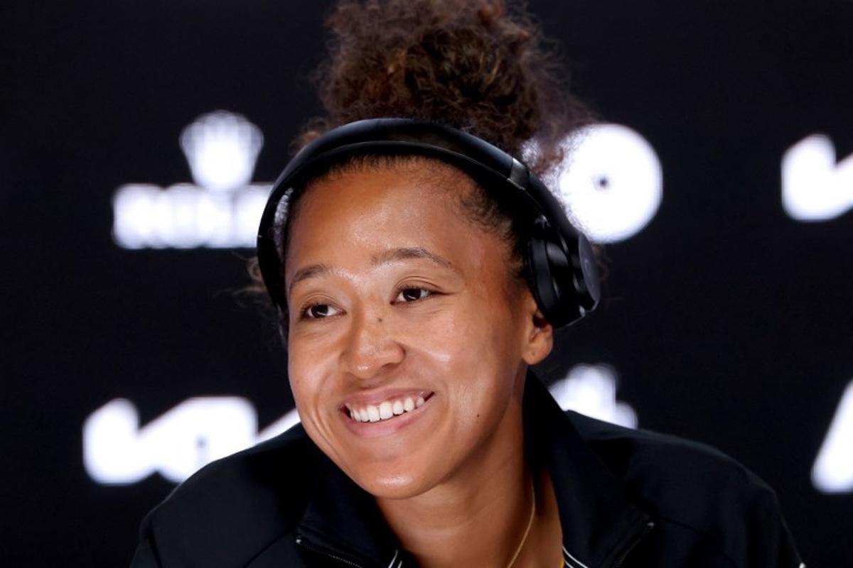 Japan's Naomi Osaka speaks at a press conference after her women's singles match against Switzerland's Belinda Bencic on day six of the Australian Open tennis tournament in Melbourne on January 17, 2025. DAVID GRAY / AFP