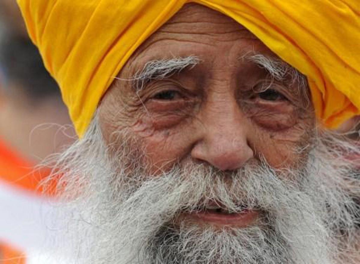 Indian-born British national Fauja Singh is pictured after crossing the finish line in the 10-km event as part of the Hong Kong Marathon on February 24, 2013. The 101-year-old Sikh believed to be the world's oldest marathon runner said on February 21 after arriving in the southern Chinese territory that he felt sad to be retiring from competitive events, as he prepared for his last race in Hong Kong. AFP PHOTO / Dale de la Rey