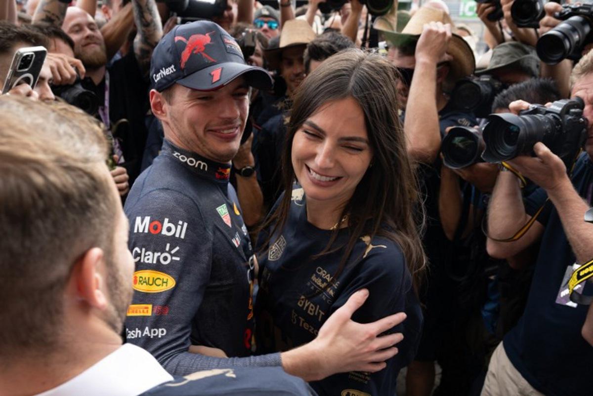 Red Bull Racing's Dutch driver Max Verstappen (C) hugs his girlfriend Kelly Piquet as the Red Bull Racing team celebrates winning the Constructors title and the Formula One United States Grand Prix, at the Circuit of the Americas in Austin, Texas, on October 23, 2022. Jim WATSON / AFP