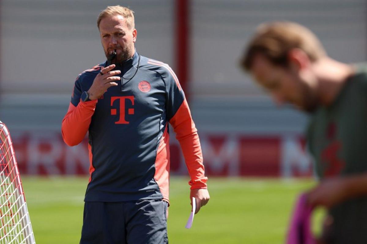Bayern Munich's British assistant coach Aaron Danks (L) looks at Bayern Munich's English forward #09 Harry Kane during a training session of FC Bayern Munich in Munich, southern Germany on April 27, 2026, one day ahead of the UEFA Champions League semi-final first leg football match against Paris Saint-Germain (PSG) to be played in Paris. Alexandra BEIER / AFP