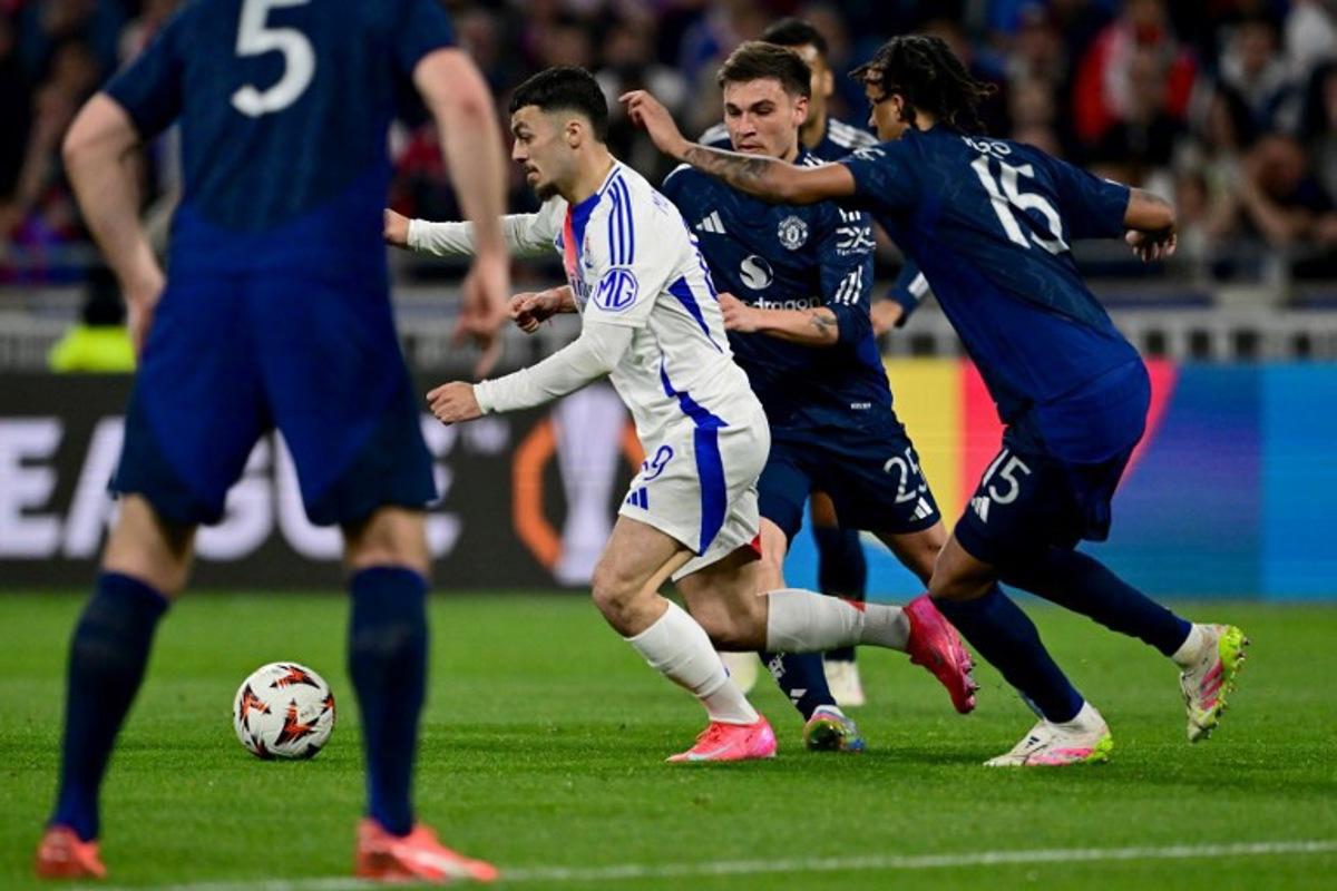 Lyon's Georgian forward #69 Georges Mikautadze (L) drives the ball during the UEFA Europa League Quarter final first leg football match between Olympique Lyonnais (OL) and Manchester United at the Parc Olympique Lyonnais Groupama stadium in Decines-Charpieu, central-eastern France, on April 10, 2025. Olivier CHASSIGNOLE / AFP