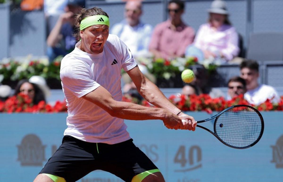 Germany's Alexander Zverev returns the ball to Spain's Alejandro Davidovich Fokina during their 2025 ATP Tour Madrid Open tennis tournament third round singles match at the Caja Magica in Madrid, on April 27, 2025. Thomas COEX / AFP