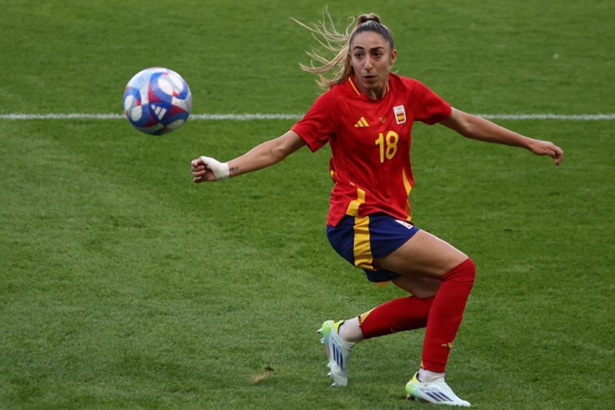 Spain's defender #18 Olga Carmona controls the ball in the women's group C football match between Spain and Nigeria during the Paris 2024 Olympic Games at the La Beaujoire Stadium in Nantes on July 28, 2024. ROMAIN PERROCHEAU / AFP