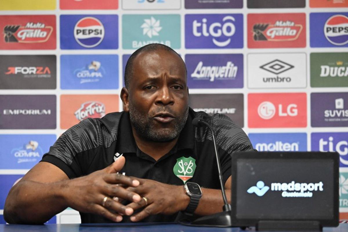Suriname's head coach Stanley Menzo speaks during a press conference at Manuel Felipe Carrera stadium in Guatemala City on November 17, 2025, ahead of the FIFA World Cup 2026 qualifier football match against Guatemala. JOHAN ORDONEZ / AFP