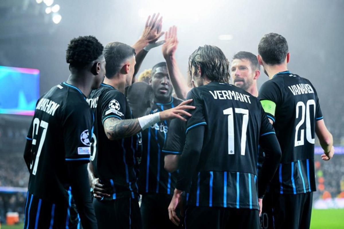 Club Brugge's Belgian forward #17 Romeo Vermant (3R) celebrates with teammates after scoring his team's second goal during the UEFA Champions League, league phase day 8, football match between Club Brugge KV and Olympique de Marseille, at the Jan Breydel Stadium in Bruges on January 28, 2026. NICOLAS TUCAT / AFP