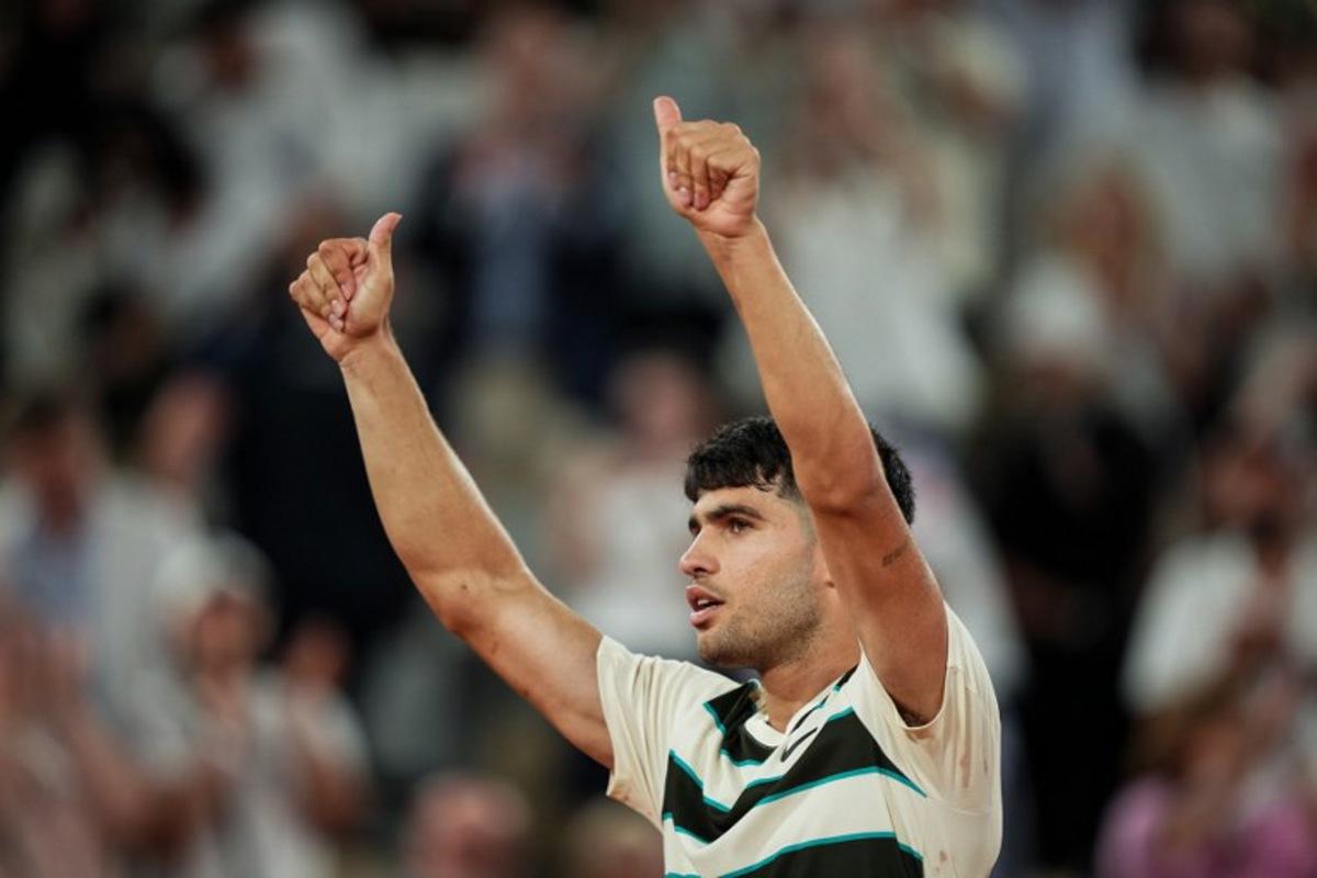 Spain's Carlos Alcaraz celebrates after winning his men's singles match against Bosnia and Herzegovina's Damir Dzumhur on day 6 of the French Open tennis tournament on Court Philippe-Chatrier at the Roland-Garros Complex in Paris on May 30, 2025. Dimitar DILKOFF / AFP