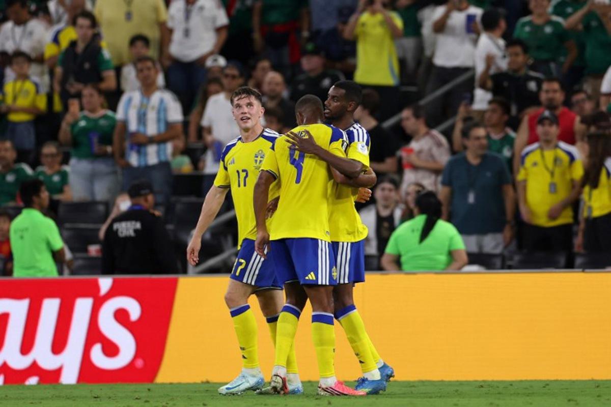 Sweden's forward #09 Alexander Isak celebrates with teammates scoring his team's second goal during the 2026 World Cup Group F football match between Sweden and Tunisia at the Monterrey Stadium in Guadalupe on June 14, 2026. Julio Cesar AGUILAR / AFP
