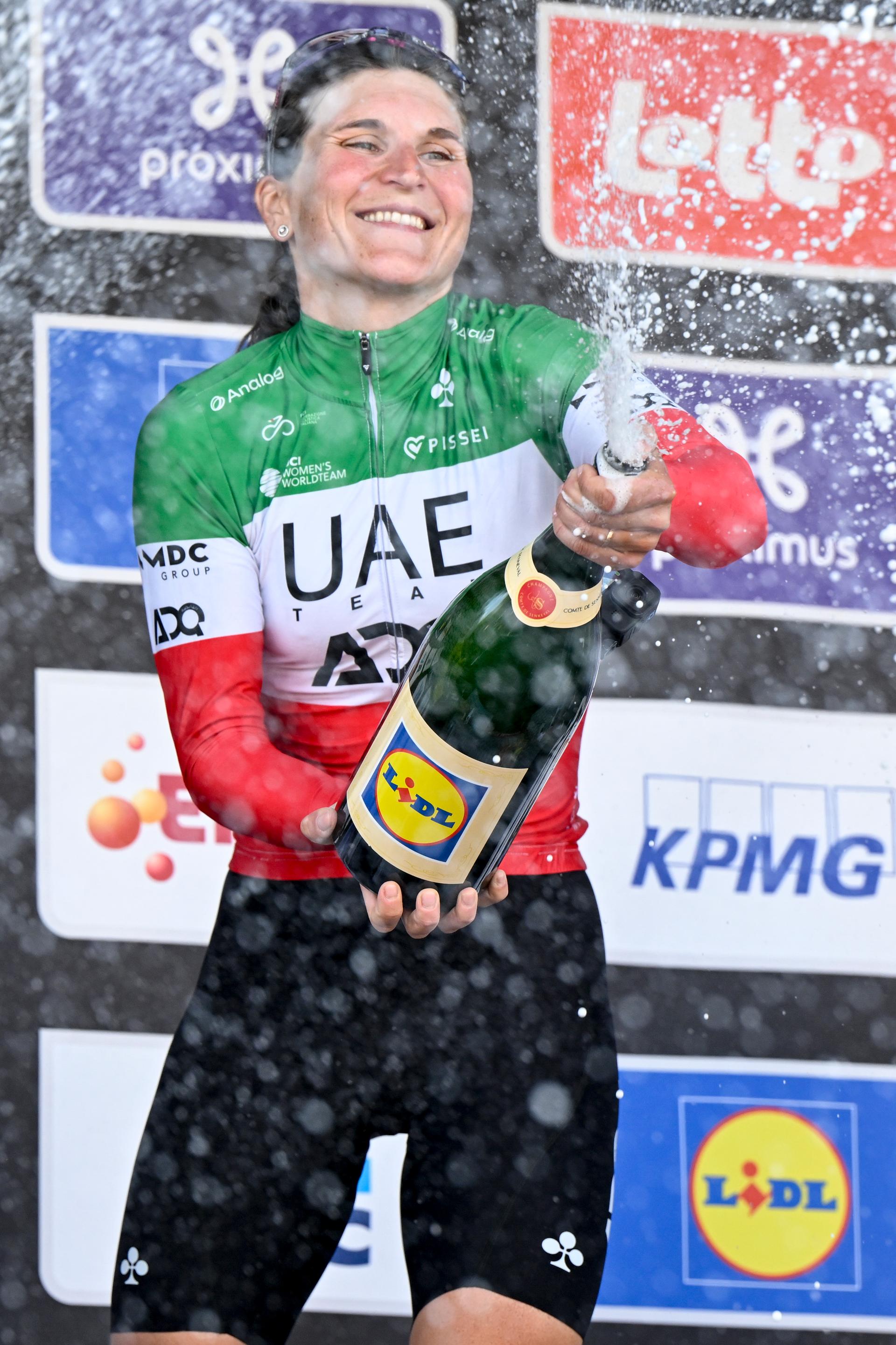 Italian Elisa Longo Borghini of UAE Team ADQ celebrates on the podium after the women's 'Brabantse Pijl' one day cycling race, 125,7km from Lennik to Overijse on Friday 18 April 2025. BELGA PHOTO TOM GOYVAERTS