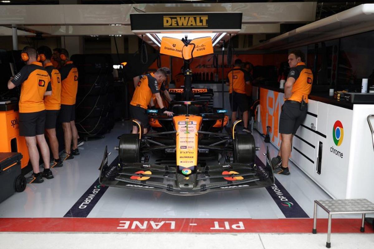 McLaren technicians work on the car of McLaren's Australian driver Oscar Piastri during a practice session for the 2025 Miami Formula One Grand Prix at Miami International Autodrome in Miami Gardens, Florida, on May 2, 2025. CHARLY TRIBALLEAU / AFP