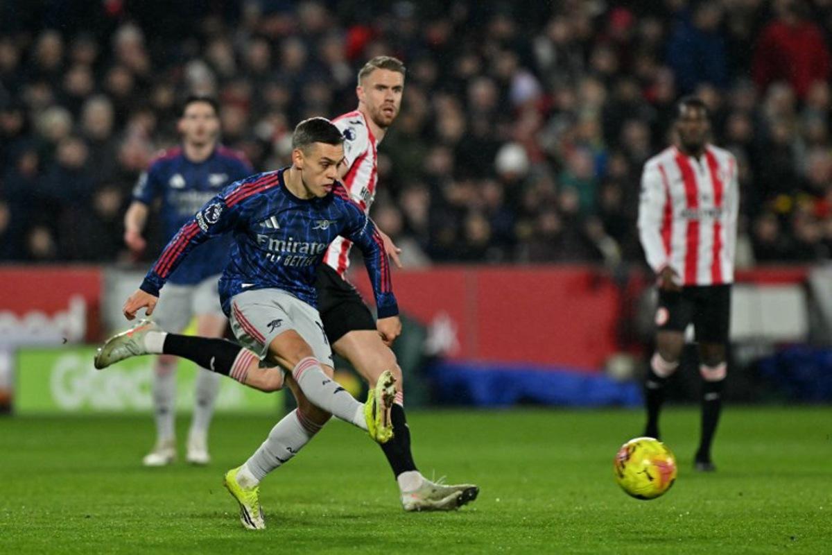 Arsenal's Belgian midfielder #19 Leandro Trossard passes the ball during the English Premier League football match between Brentford and Arsenal at the Gtech Community Stadium in London on February 12, 2026. Glyn KIRK / AFP