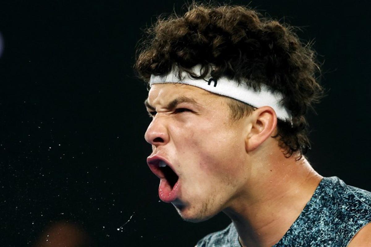 USA's Ben Shelton reacts on a point to Italy's Jannik Sinner during their men's singles quarter-final match on day eleven of the Australian Open tennis tournament in Melbourne on January 28, 2026. Izhar Khan / AFP
