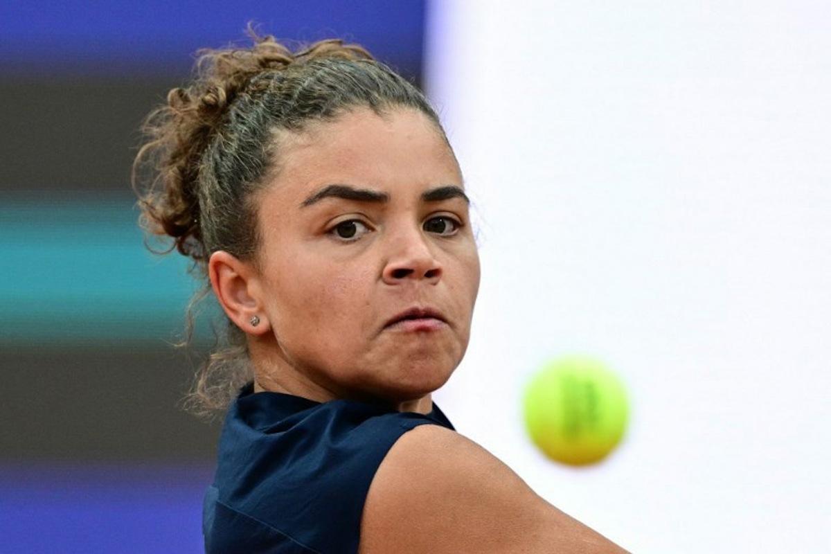 Italy's Jasmine Paolini plays a backhand return to USA's Coco Gauff during their women's singles final match for the WTA Rome Open tennis tournament at Foro Italico in Rome on May 17, 2025. Tiziana FABI / AFP