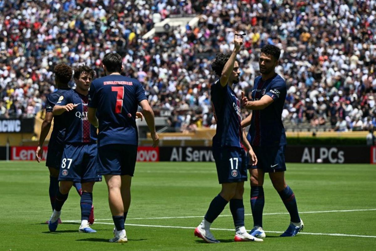 Paris Saint-Germain's Portuguese midfielder #17 Vitinha (2ndR) celebrates with teammates after scoring a goal during the Club World Cup 2025 Group B football match between France's Paris Saint-Germain and Spain's Atletico de Madrid at the Rose Bowl stadium in Los Angeles on June 15, 2025. YURI CORTEZ / AFP