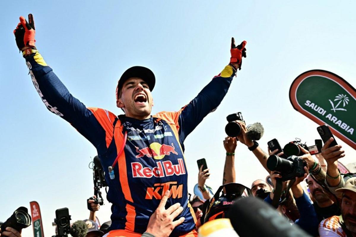 Argentine rider Luciano Benavides with a Ktm 450 Rally Factory celebrates after winning the 48th edition of the Dakar Rally 2026 in Yanbu, Saudi Arabia, on January 17, 2026. Giuseppe CACACE / AFP