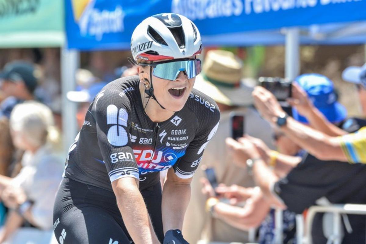 FFDJ United - Suez rider Ally Wollaston of New Zealand celebrates at the finishing line to win the women's first stage of the Tour Down Under cycling race in Adelaide on January 17, 2026. Brenton Edwards / AFP