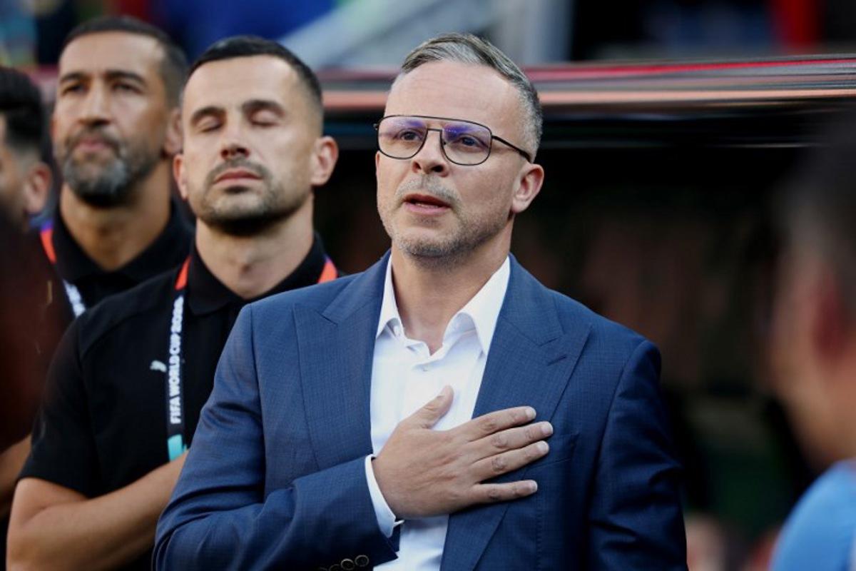 Morocco's head coach Mohamed Ouahbi listens his national anthem the 2026 World Cup Group C football match between Scotland and Morocco at the Boston Stadium in Foxborough on June 19, 2026. FRANCK FIFE / AFP