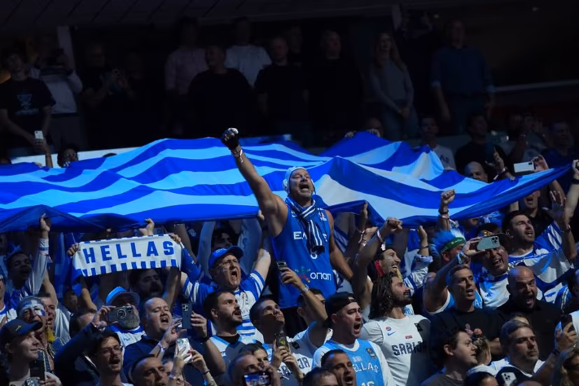 Greece's fans cheer for their team prior to the start of the FIBA EuroBasket 2025 semi-final basketball match between Greece and Turkey in Riga, Latvia, on September 12, 2025. Gints Ivuskans / AFP