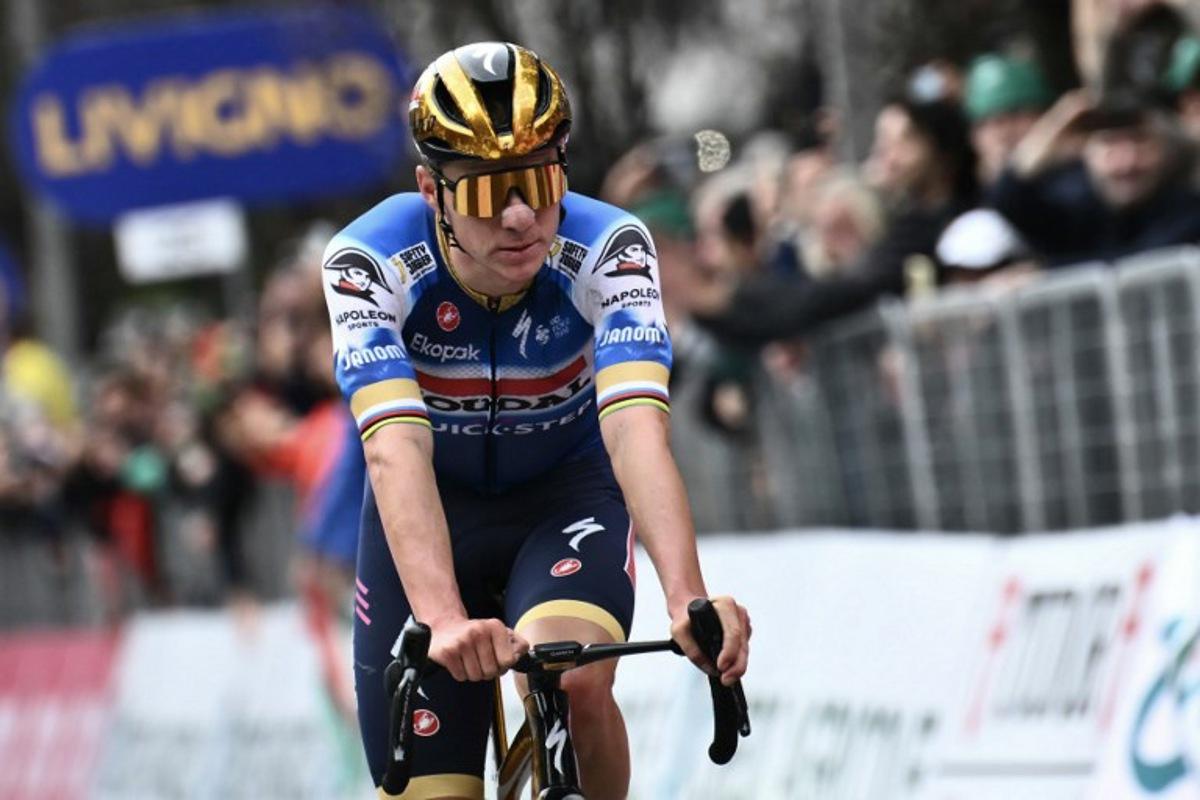Soudal Quick-Step team's Belgian rider Remco Evenepoel cycles to the finish line to take second place in the 118th edition of the Giro di Lombardia (Tour of Lombardy), a 252km cycling race from Bergamo to Como on October 12, 2024. Marco BERTORELLO / AFP