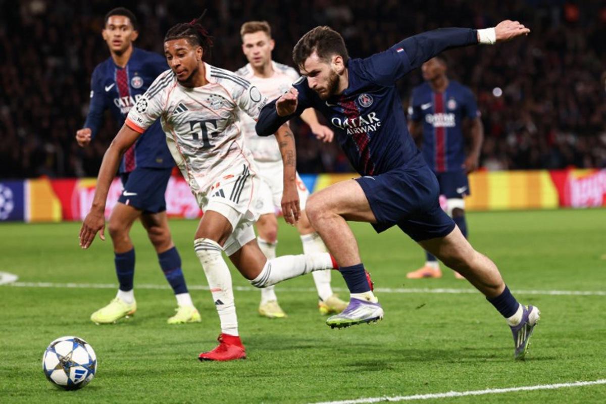 Paris Saint-Germain's Georgian forward #07 Khvicha Kvaratskhelia (R) fights for the ball with Bayern Munich's French midfielder #17 Michael Olise (L) during the UEFA Champions League, league phase day 4, football match between Paris Saint-Germain (PSG) and FC Bayern Munich at the Parc des Princes in Paris, on November 4, 2025. FRANCK FIFE / AFP