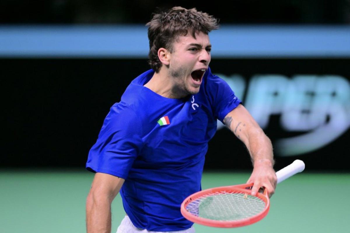 Italy's Flavio Cobolli reacts as he plays against Spain's Jaume Munar Clar during their 2025 Davis Cup men's single final tennis match at the Super Tennis Arena in Bologna, northen Italy, on November 23, 2025. Tiziana FABI / AFP