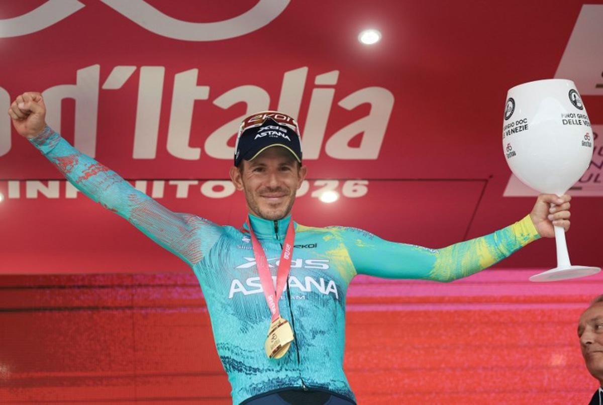 XDS Astana Team Italian rider Davide Ballerini celebrates on the podium after winning the 6th stage of the Giro d'Italia 2026 - Tour of Italy cycling race between Paestum and Naples, southern Italy on May 14, 2026. Luca Bettini / AFP
