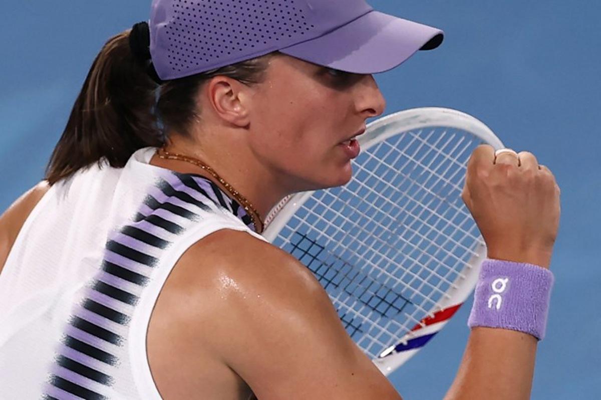 Poland's Iga Swiatek reacts after a point against Russia's Anna Kalinskaya during their women's singles match on day seven of the Australian Open tennis tournament in Melbourne on January 24, 2026. IZHAR KHAN / AFP