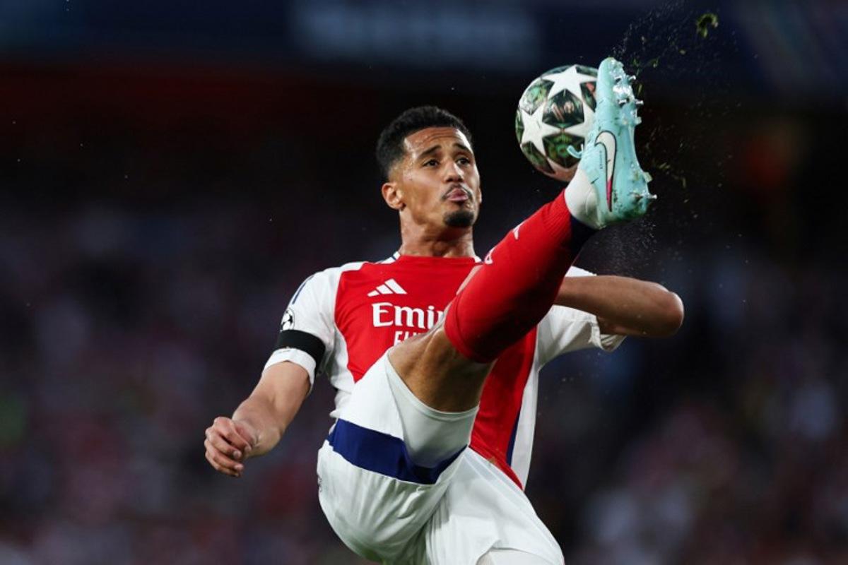 Arsenal's French defender #02 William Saliba controls the ball during the UEFA Champions League Semi-final First Leg football match between Arsenal and Paris Saint-Germain (PSG) at the Emirates Stadium in north London, on April 29, 2025. Adrian Dennis / AFP